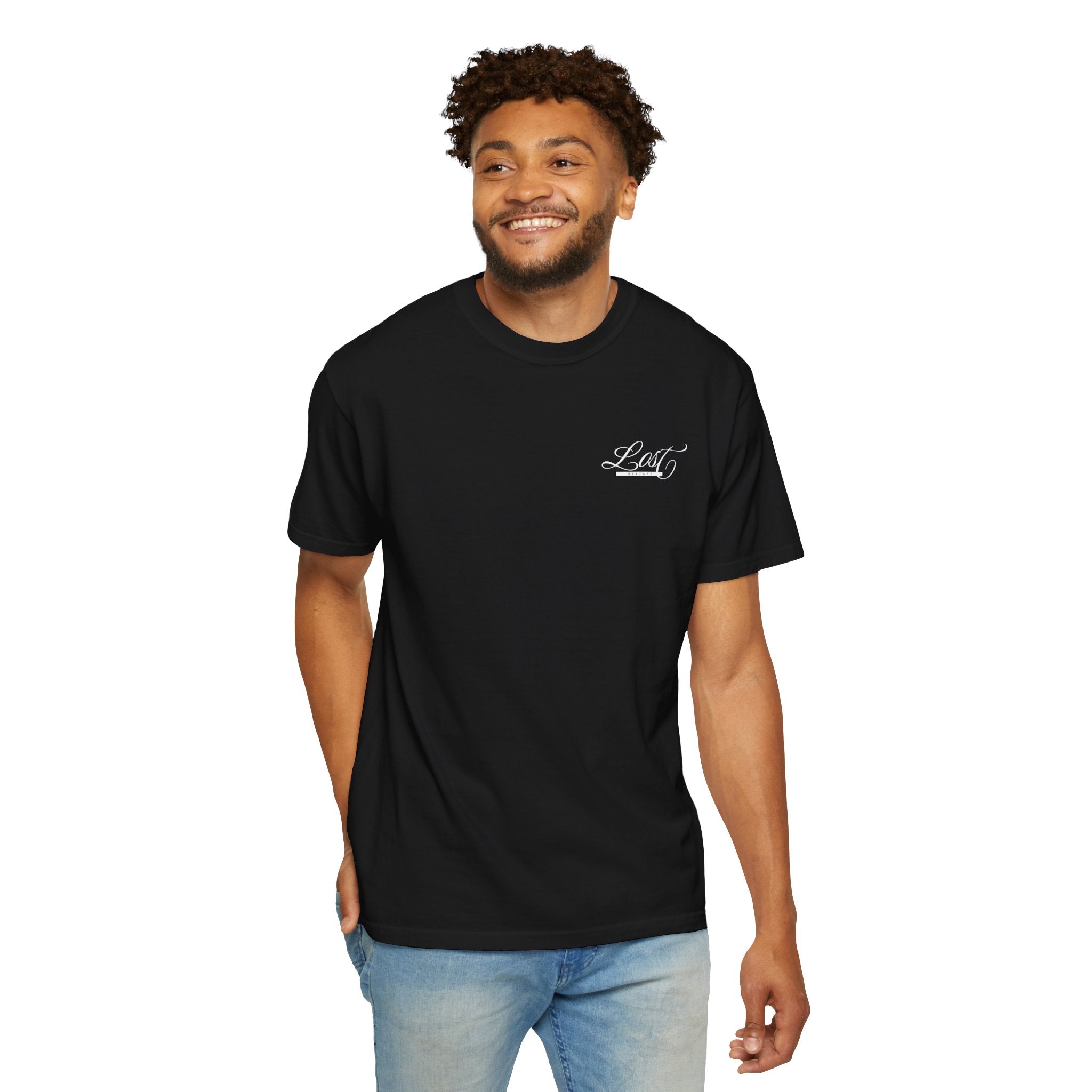 Man wearing a black t-shirt with a logo on a white background